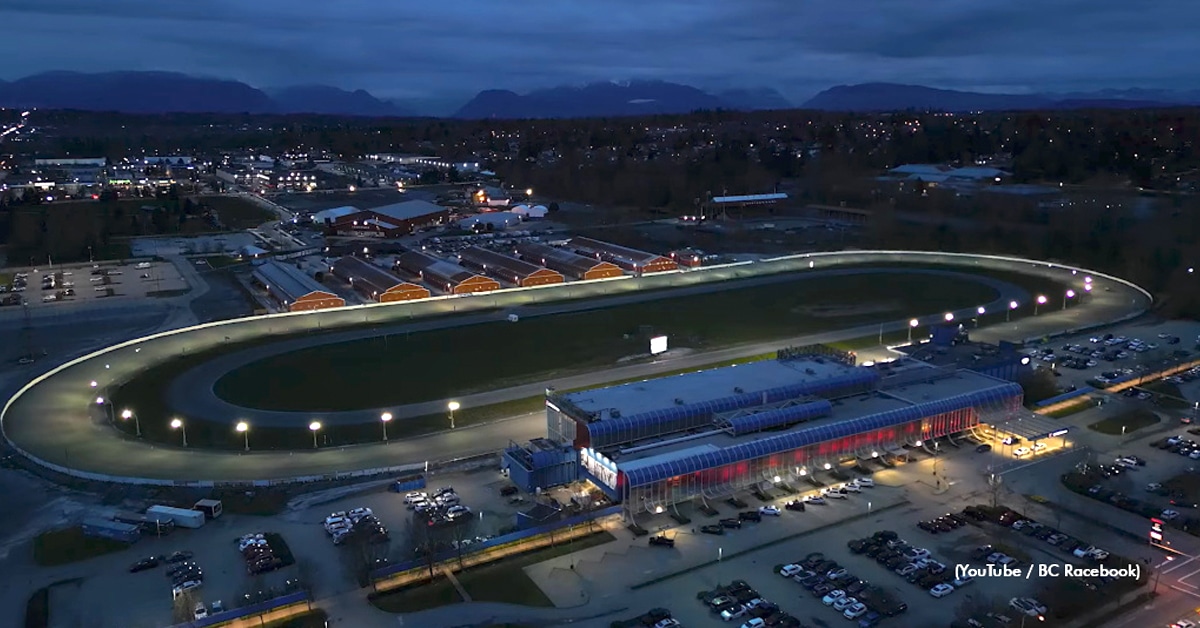 An aerial, night time view of a racetrack in BC.