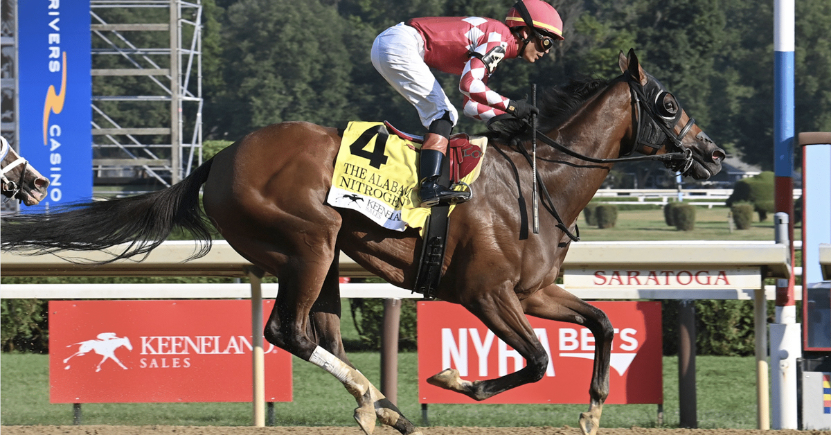 A bay horse winning a race at Saratoga.