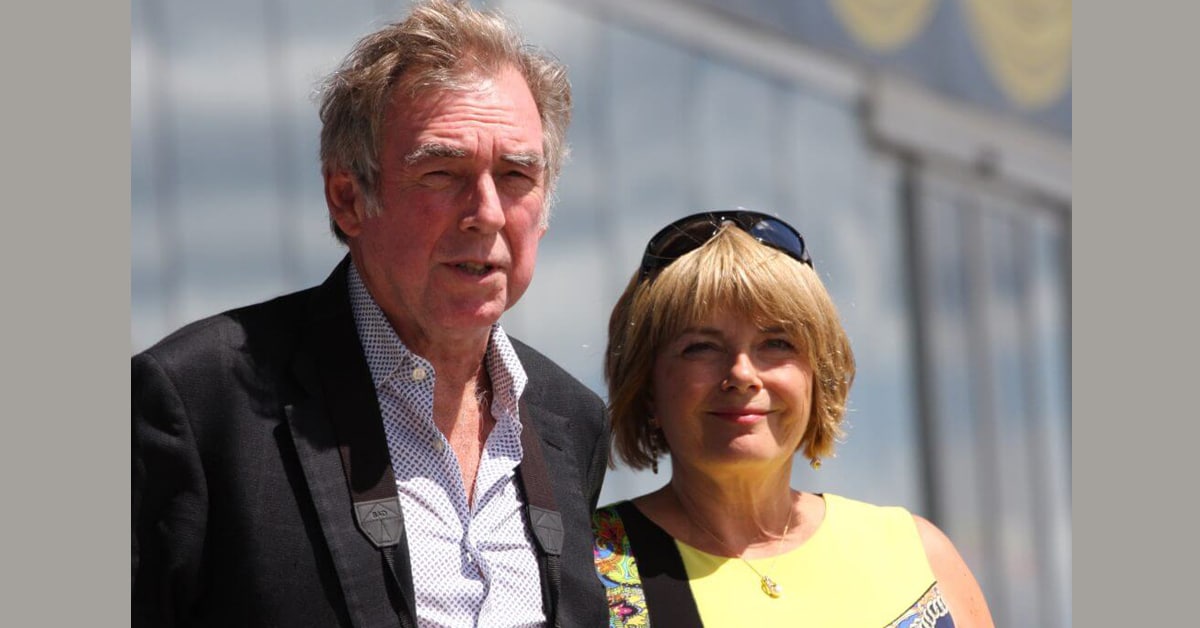A man and woman in the stands at Woodbine racetrack.