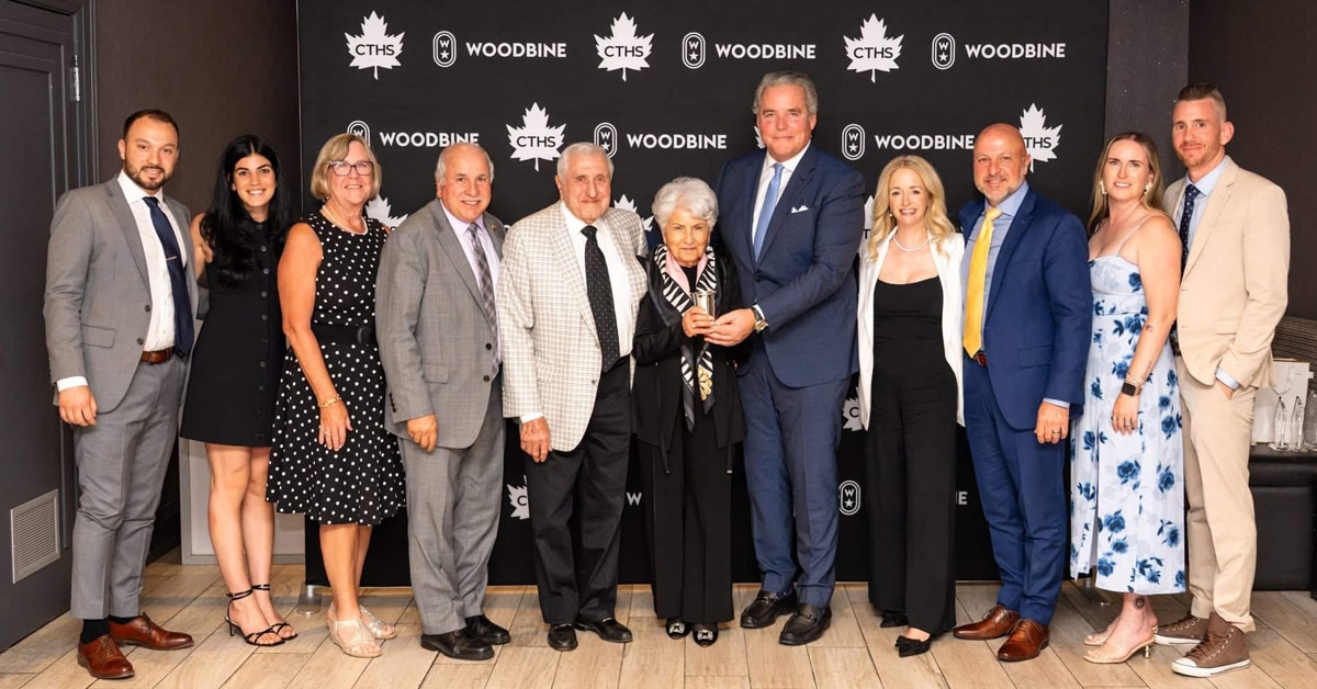 A group of people at an awards ceremony.