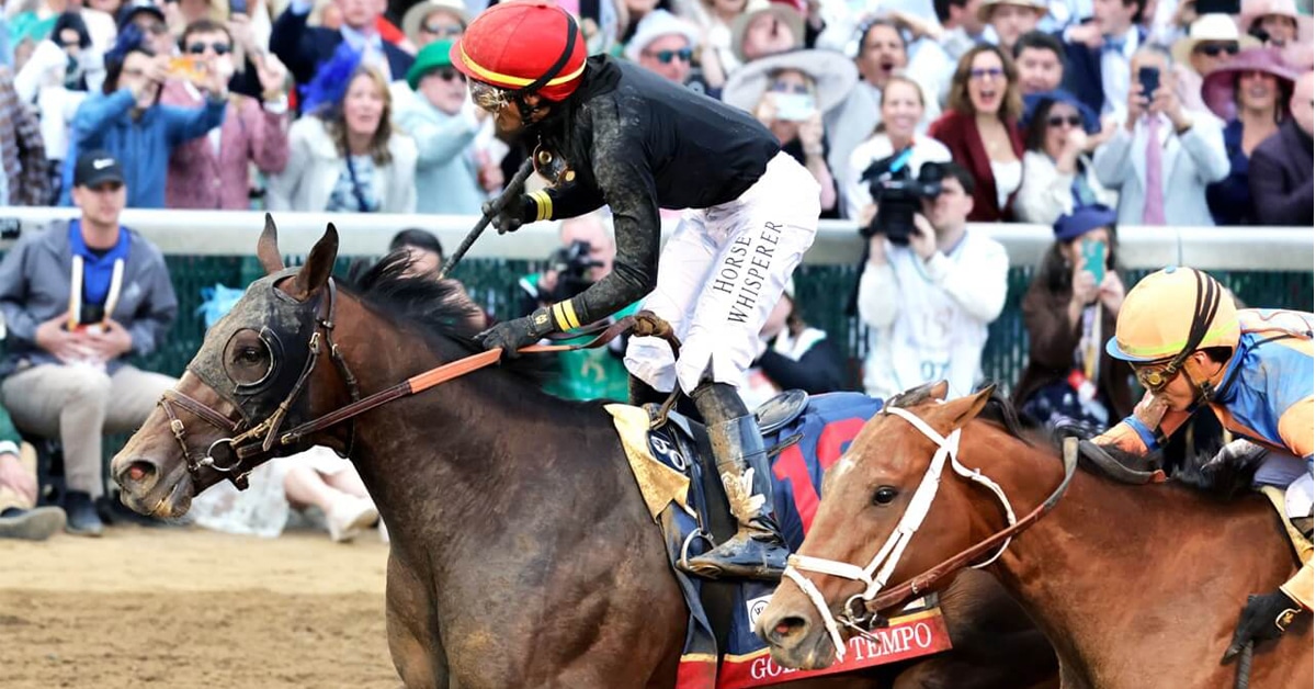 Horses cross in the finish line at Churchill Downs.