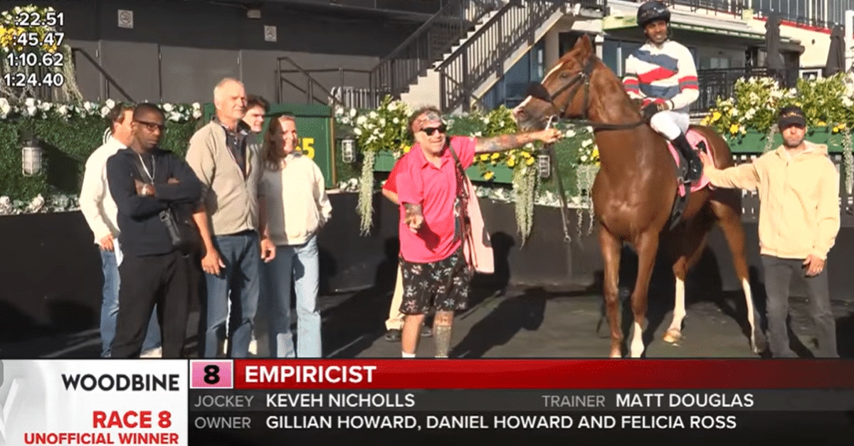 A screenshot of a winners circle photo at Woodbine.