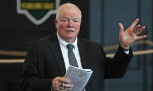 A man takings bids at an auction.